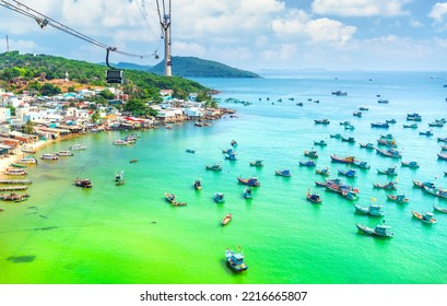 The longest cable car ride in the world, Phu Quoc island in South Vietnam. Below is traditional fishermen boats lined in the harbor of An Thoi town in the popular Hon Thom island. Travel concept.