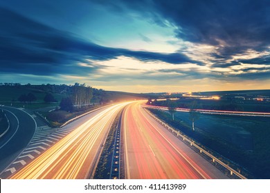 Long-exposure sunset over a highway with Instagram vintage faded effect - Shutterstock ID 411413989
