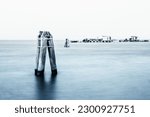 The long-expsure shot of the tranquil fishing huts in Pealestrina, Venice