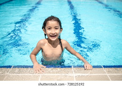 Longhair Boy Swimming In The Pool For Sport,excercise,healthy At School Or Public Community Pool