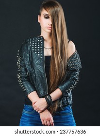 Long-haired Girl In A Leather Jacket With Studs