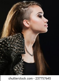 Long-haired Girl In A Leather Jacket With Studs