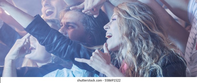 Long-haired Woman Shouting During The Rock Concert