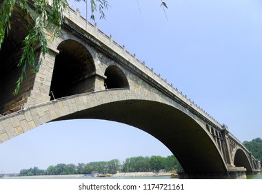 Longmen Bridge inside Luoyang Longmen Grottoes Scenic Area in Luoyang city Hehan province China. - Shutterstock ID 1174721161