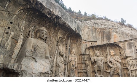 The Longmen Grottoes (Longmen Caves) Ancient Chinese Buddhist art. stone statues of Buddha, Luoyang in Henan province, China