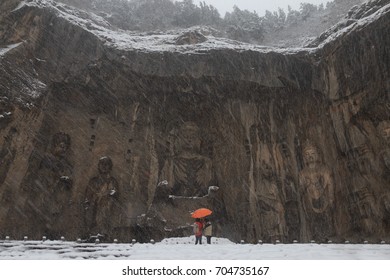 Longmen Grottoes (Longmen Caves) At Luoyang, China Under Heavy Snow. The Longmen Grottoes Are One Of The Finest Examples Of Chinese Buddhist Art.