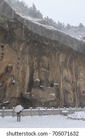 Longmen Grottoes (Longmen Caves) At Luoyang, China Under Heavy Snow. The Longmen Grottoes Are One Of The Finest Examples Of Chinese Buddhist Art.