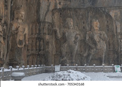 Longmen Grottoes (Longmen Caves) At Luoyang, China Under Heavy Snow. The Longmen Grottoes Are One Of The Finest Examples Of Chinese Buddhist Art.