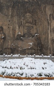 Longmen Grottoes (Longmen Caves) At Luoyang, China Under Heavy Snow. The Longmen Grottoes Are One Of The Finest Examples Of Chinese Buddhist Art.