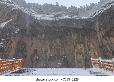 Longmen Grottoes (Longmen Caves) At Luoyang, China Under Heavy Snow. The Longmen Grottoes Are One Of The Finest Examples Of Chinese Buddhist Art.