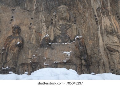 Longmen Grottoes (Longmen Caves) At Luoyang, China Under Heavy Snow. The Longmen Grottoes Are One Of The Finest Examples Of Chinese Buddhist Art.