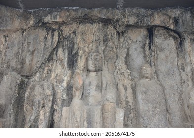 LONGMEN GROTTOES, CHINA - JANUARY 10, 2017: The Chinese Buddhist historical art statues in the area of Longmen caves, Luoyang