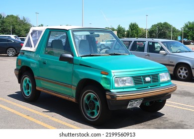 Longmont, CO USA - August 4, 2022: 1990s Geo Tracker Small Compact SUV With Convertible Top