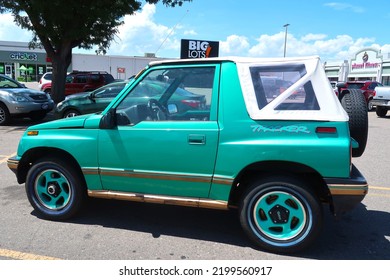 Longmont, CO USA - August 4, 2022: 1990s Geo Tracker Small Compact SUV With Convertible Top