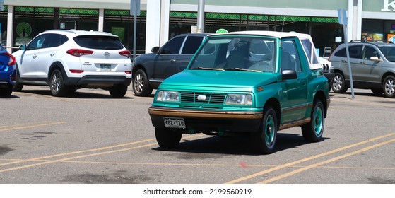 Longmont, CO USA - August 4, 2022: 1990s Geo Tracker Small Compact SUV With Convertible Top