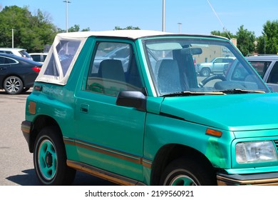 Longmont, CO USA - August 4, 2022: 1990s Geo Tracker Small Compact SUV With Convertible Top