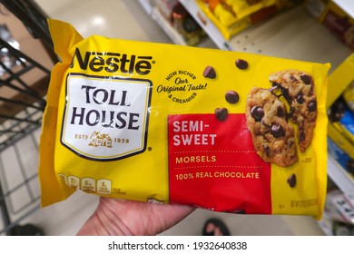 Longmont, CO USA - March 7, 2021: A Bag Of Nestle Toll House Semi-sweet Chocolate Chips In The Hand Of A Shopper At The Grocery Store. Holiday Baking Ingredient.       