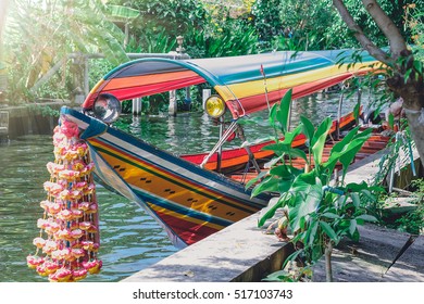 Longtail Boat On The Bangkok River.Waterfront Park For Commuters