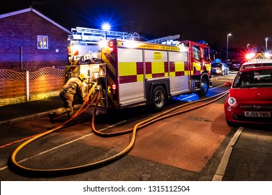 Longton, Stoke On Trent, Staffordshire - 16th February 2019 - Fire Engines And Firemen Attend An Emergency House Fire On A Quiet Housing Estate In The City Caused By A Fault Washing Machine Wiring