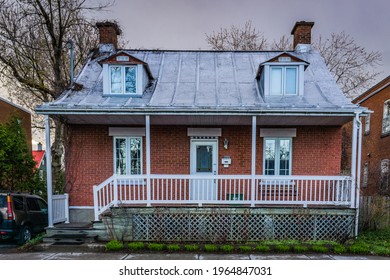 Longueuil, Qc, Canada - May 3rd 2020: Beautiful facade of traditionnal housing with aluminum roof in the historic center of Longueuil in Quebec (Canada)