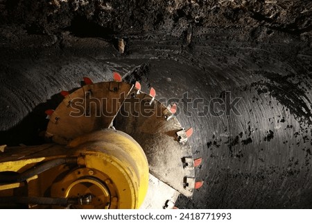 Longwall mining shearer machine. Poland coal mine interior - underground tunnel. Industry in Zabrze, Upper Silesia.