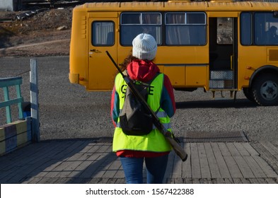 Longyearbyen, Svalbard / Norway - 08 15 2019: Woman With Gun Preppered To Protect Herself. Tourist Traveling And Visiting Abandoned Sights In Pyramiden, Svalbard.