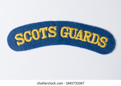 Lonond, Uk, 05/05/2020 A Scots Guard Vintage Retro Antique Military Felt Patch Badge On A White Background. Icon Military And War Memorabilia And Collectables. Sew On Patches For Military Clothing. 