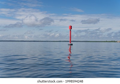 Loodsman or navigation pilot. The sea markers that indicate the route on the water. Baltic sea between tiny island Abruka and Roomassare port. Sign post that helps navigate to the harbor.