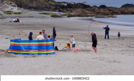 Looe, Cornwall, UK. 05.27.2019 Bank Holiday Monday Overcast With A Little Rain Still People At The Beach