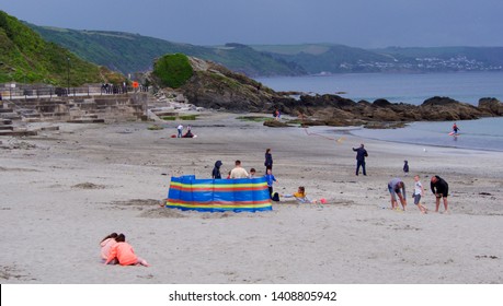 Looe, Cornwall, UK. 05.27.2019 Bank Holiday Monday Overcast With A Little Rain Still People At The Beach