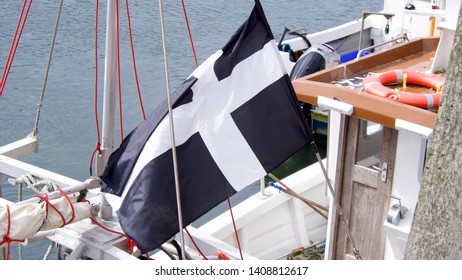 Looe, Cornwall, UK. 05.27.2019 Cornish Flag Being Flown From A Cornish Fishing Boat Bank Holiday Monday 