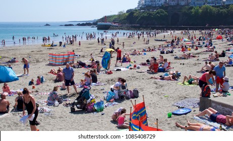 Looe, Cornwall, UK May Bank Holiday Monday 05/07/2018. East Looe Beach bust with day trippers and tourists as well as locals enjoying record breaking temperatures in the UK springtime