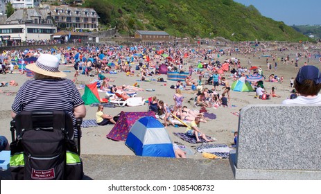 Looe, Cornwall, UK May Bank Holiday Monday 05/07/2018. East Looe Beach Bust With Day Trippers And Tourists As Well As Locals Enjoying Record Breaking Temperatures In The UK Springtime