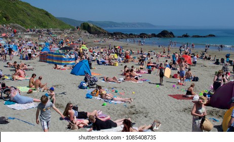 Looe, Cornwall, UK May Bank Holiday Monday 05/07/2018. East Looe Beach Bust With Day Trippers And Tourists As Well As Locals Enjoying Record Breaking Temperatures In The UK Springtime