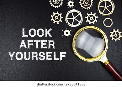 Look After Yourself text message with magnifying glass on black background