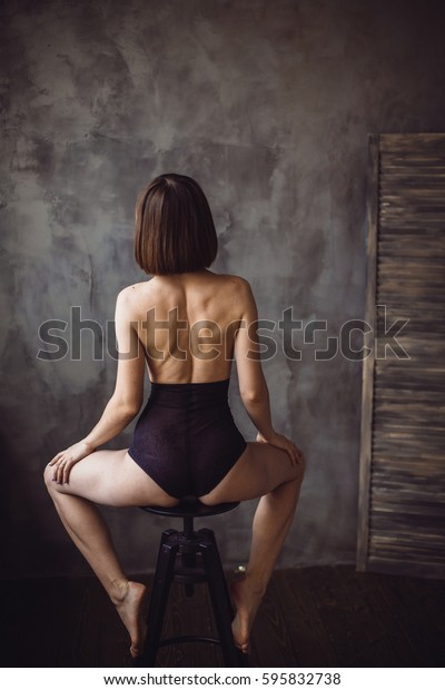 Naked Women Looking Behind Her