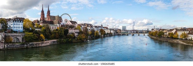 Look at boardwalk in Basel - city near Switzerland, Germany and France, included cathedrals two towers and russian wheel