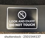 look and enjoy do not touch sign