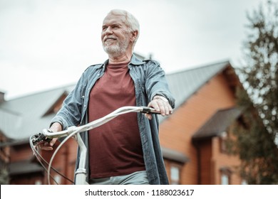 Look In Future. Positive Delighted Bearded Retired Man Looking Forward While Thinking About Healthy Life