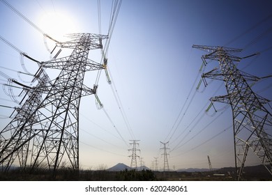 Look up High voltage of powertransmission towers - Shutterstock ID 620248061