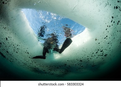 Look at Ice hole from underwater 
