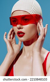 A Look Into The Future. NFT. A Girl From The Future In Red Glasses Looks Forward Touches A Swimming Cap