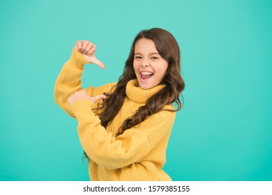 Look At Me. Lucky Kid. Positivity Concept. Emotional Baby. Positive Child. Positive Attitude To Life. Positive Mood. Kids Psychology. Adorable Smiling Girl Wear Yellow Sweater Turquoise Background.