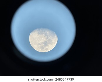 Look at the moon through a telescope