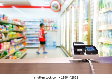 Look Out From The Payment Counter, Blur Image Of Inside The Convenience Store As Background.