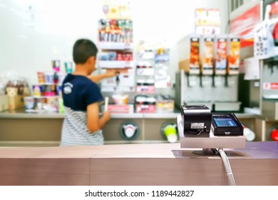 Look Out From The Payment Counter, Blur Image Of Inside The Convenience Store As Background.