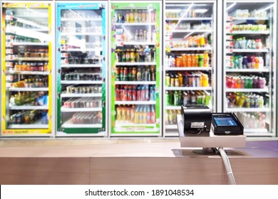 Look Out From The Payment Counter, Blur Image Of A Beverage Cooler In A Convenience Store As Background.