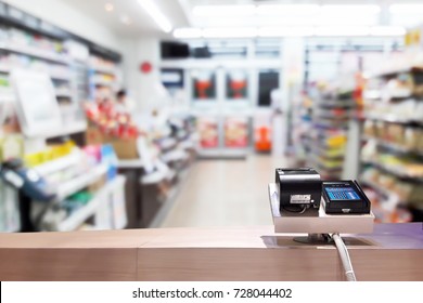 Look Out From The Payment Counter, Blur Image Of Inside The Convenience Store As Background.