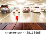 Look out from the table, blur image of parking lot as background.