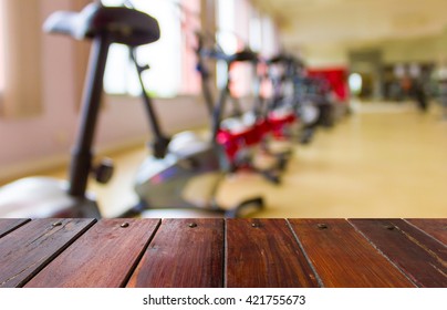 Look out from the table, blur image of gym as background.